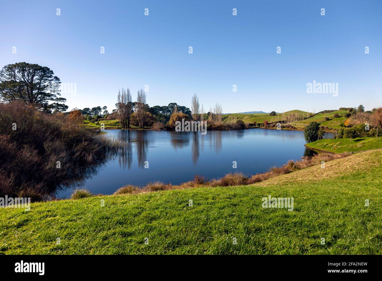 View of a lake at  the Hobbiton Movie Set, Matamata, Waikato, New Zealand Stock Photo