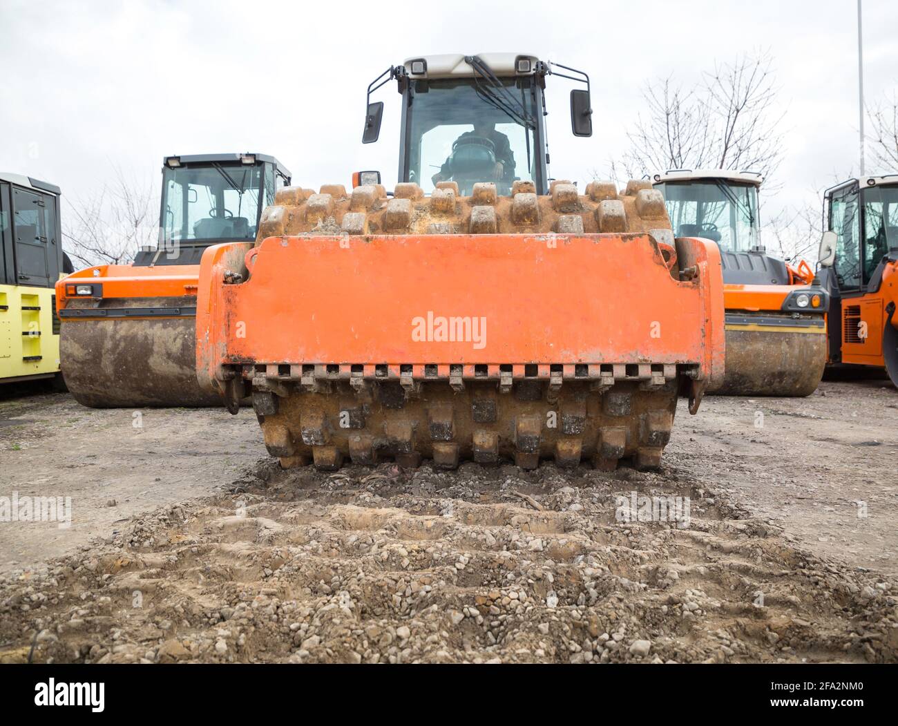 large, heavyduty vibratory compactor for compacting the soil. Other