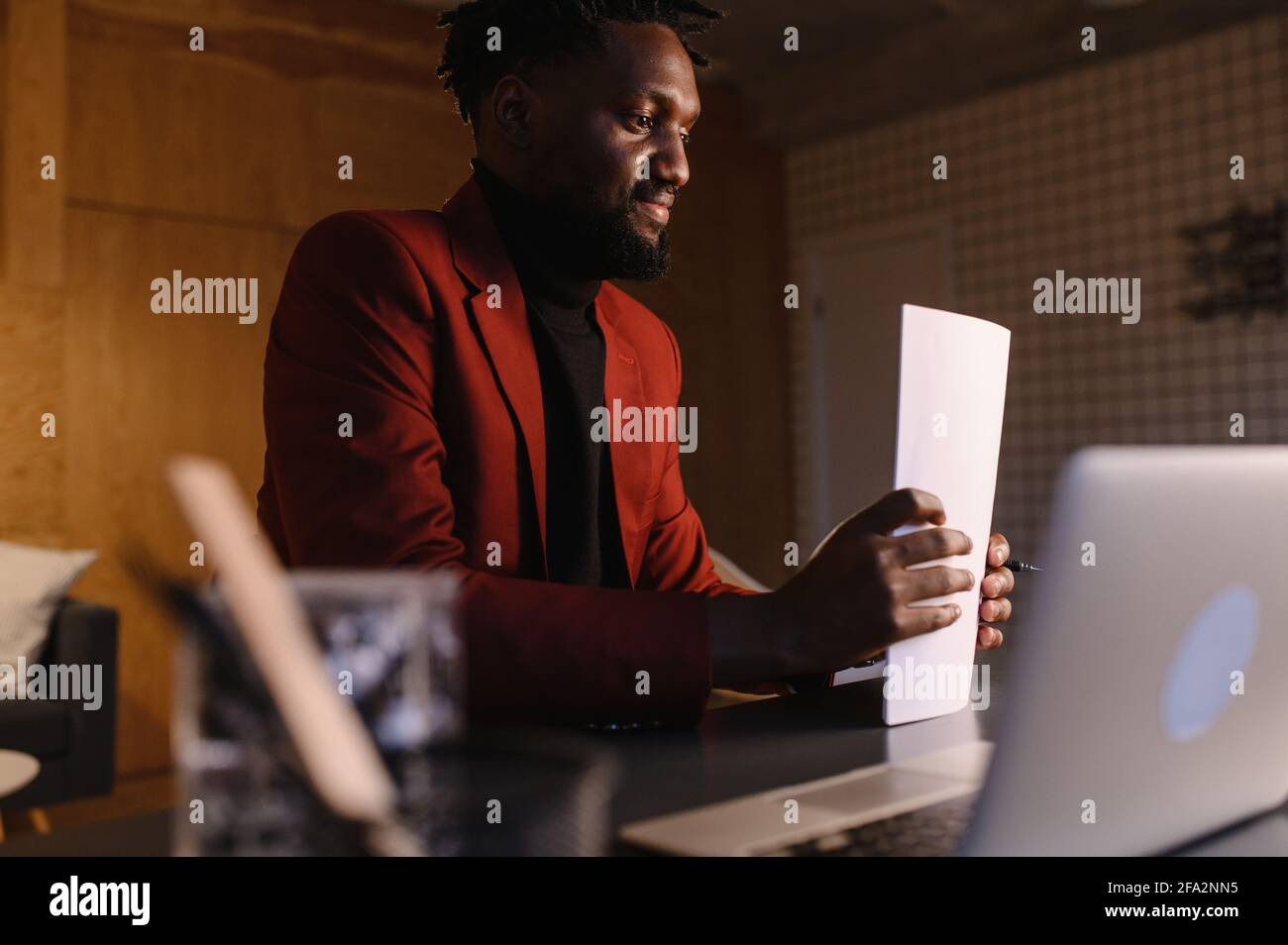 black business man working on laptop and taking notes Stock Photo - Alamy