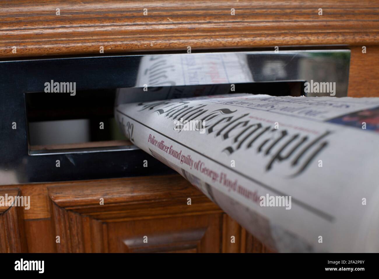 The Daily Telegraph British Daily newspaper Daily newspaper in front door  letterbox Stock Photo