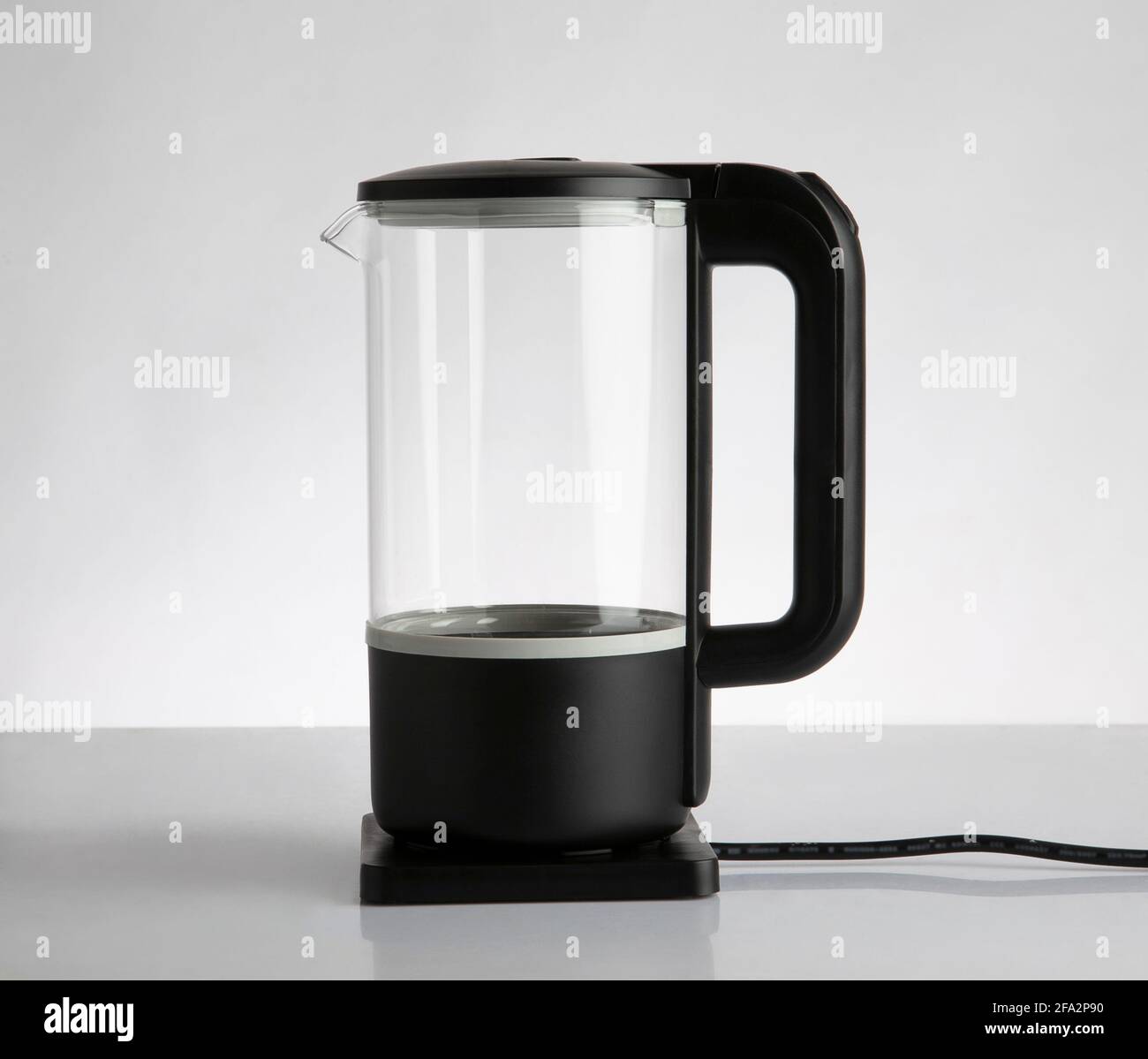 Empty electric glass kettle isolated on white background Stock Photo