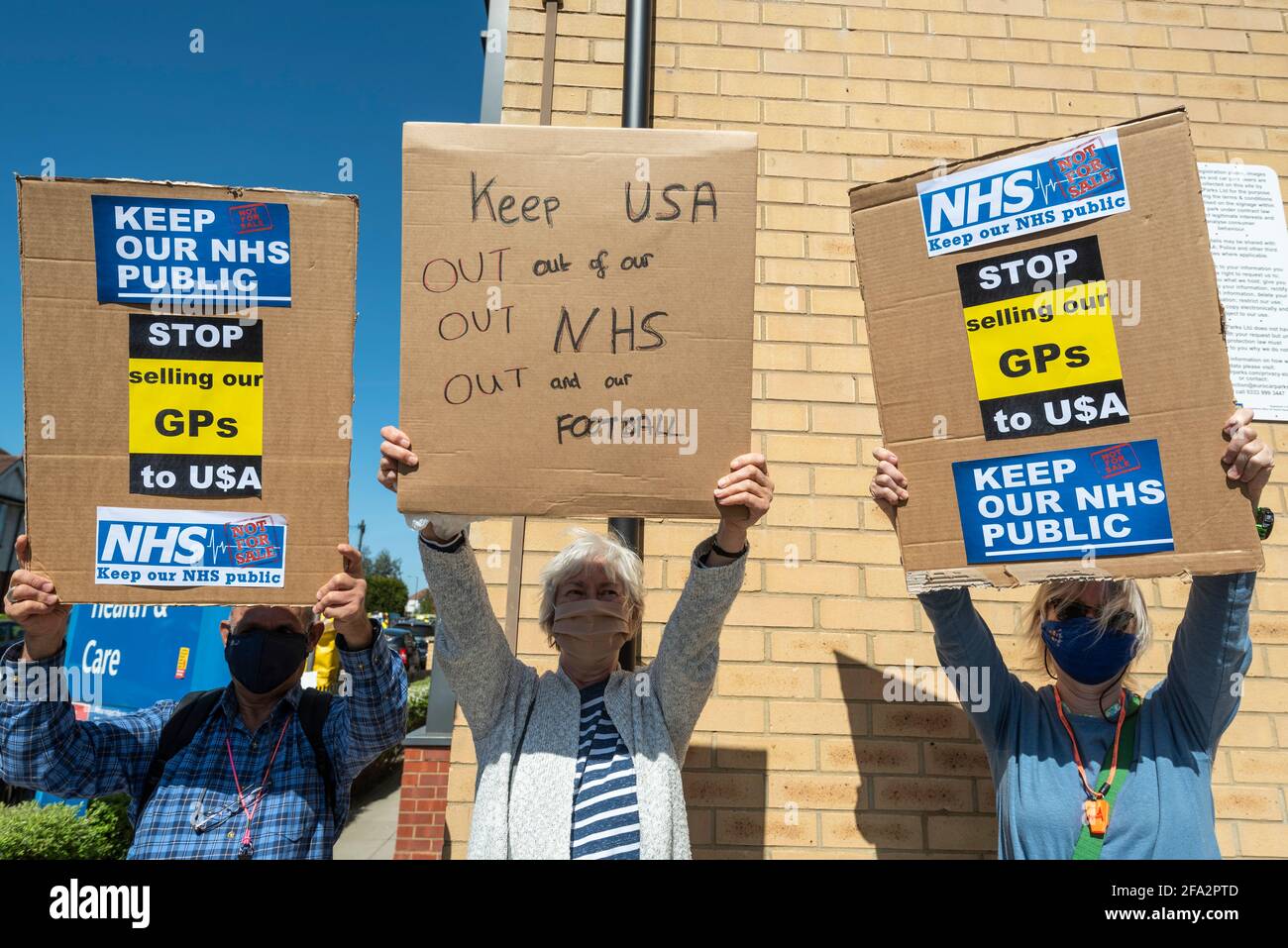 London, UK, 22 April 2021.  Local residents protest outside Willesden Centre for Health & Care at the takeover of 49 GP practices in England by a US based private health company, Centene, through its UK subsidiary, Operose Health.  Centene has recently taken over AT Medics, a primary care provider responsible for 49 GP surgeries and over 370,000 patients in the Greater London area, including the Burnley practice based at Willesden Centre for Health & Care.  Similar protests are taking place across the capital. Credit: Stephen Chung / Alamy Live News Stock Photo