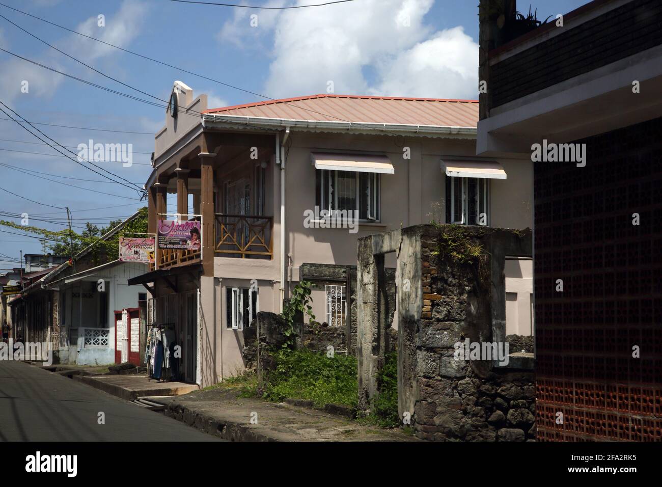 Gouyave Grenada  Street Scene xpressions hair and fashion shop and Rundown building Stock Photo