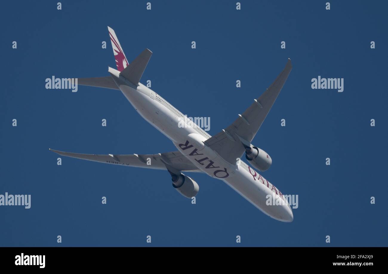 Qatar Airways Boeing 777 leaves London Heathrow en route to Doha on 22 April 2021 in clear blue sky. Credit: Malcolm Park/Alamy. Stock Photo