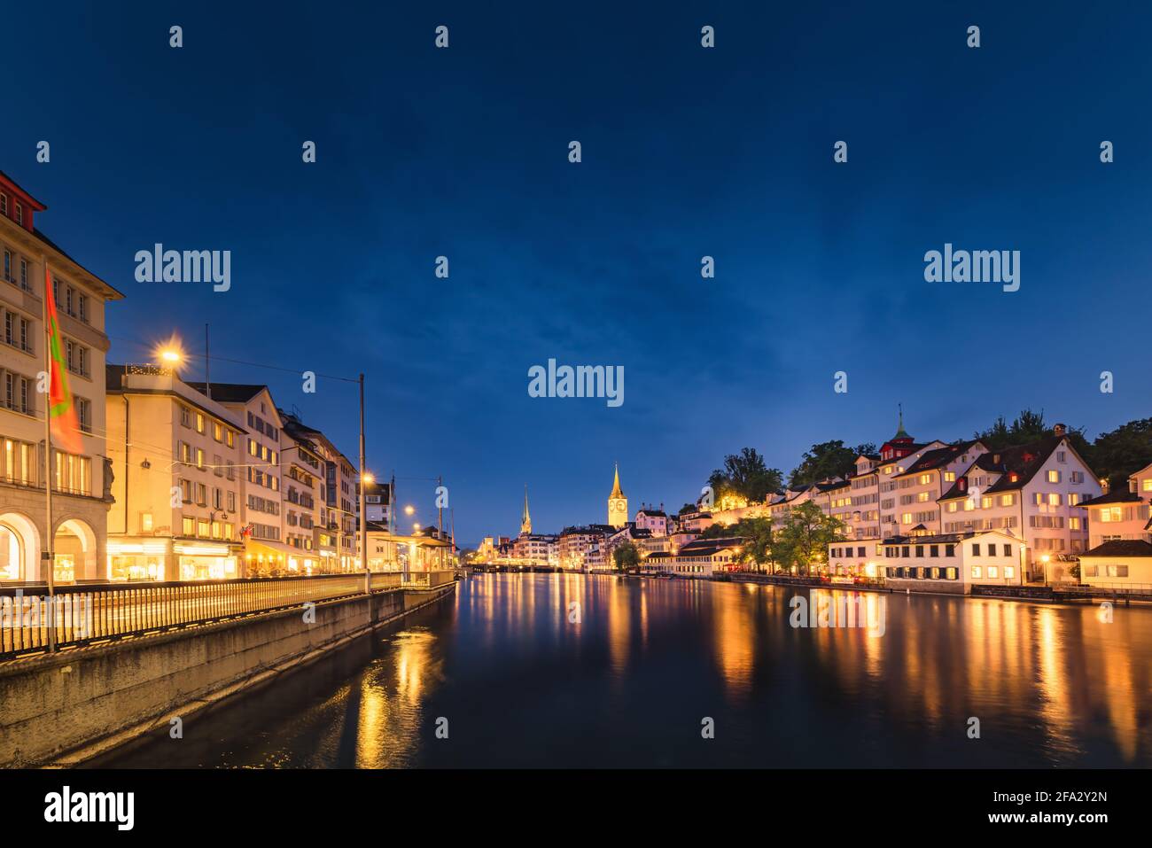 Cityscape of Zurich City and Illuminated Lights at Nightlife, Landscape Historic Old Town of Zurich, Switzerland. Panoramic View Medieval Architecture Stock Photo