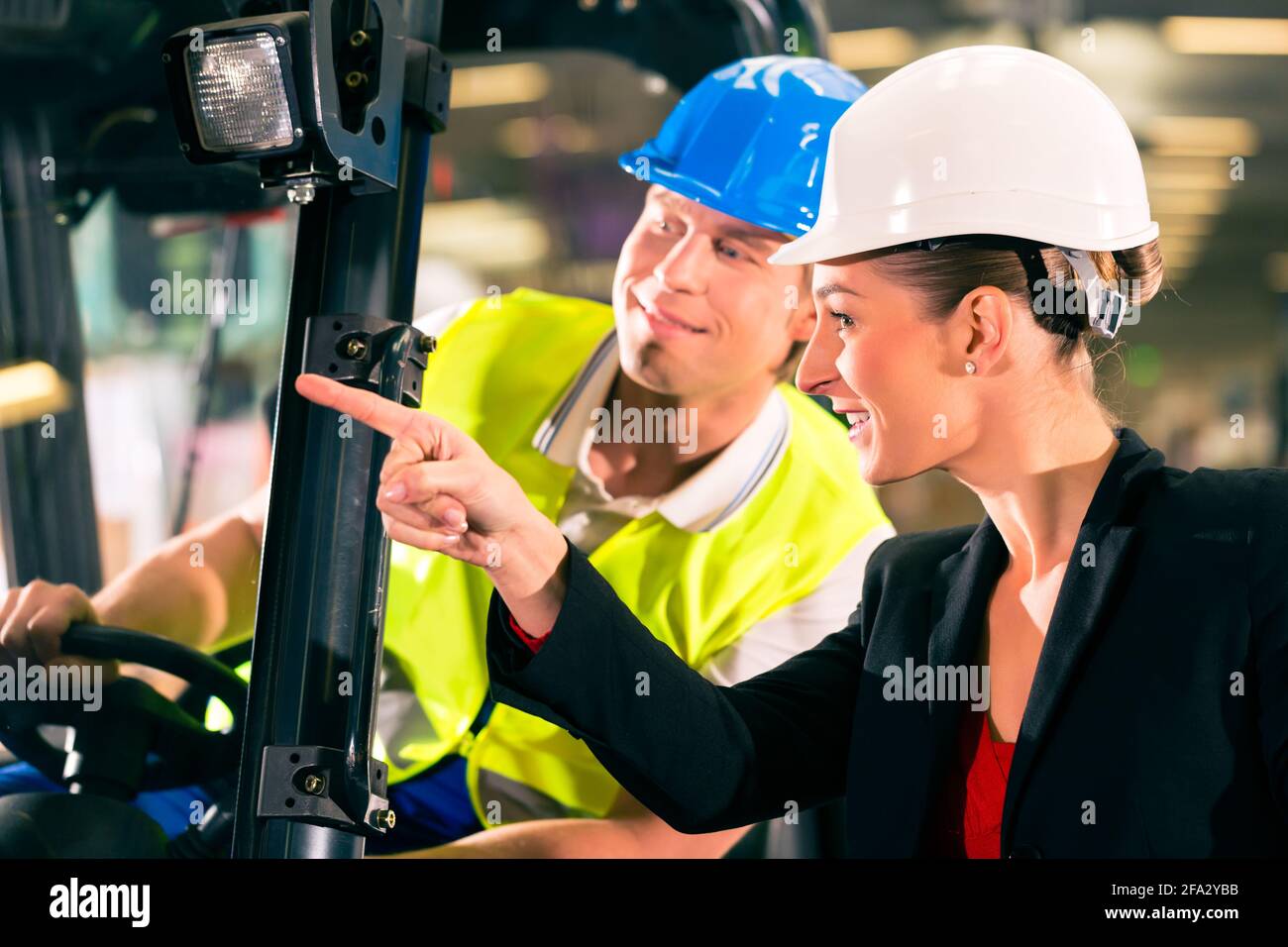 Forklift driver at warehouse of freight forwarding company, female ...