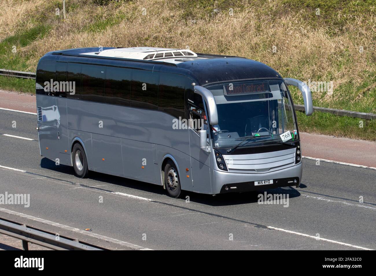 2013 Caetano Levant single deck PSV school contract; Coach tour, bus routes, school contracts, private hire, day excursions and passengers holiday travel on the M6 near Manchester Stock Photo