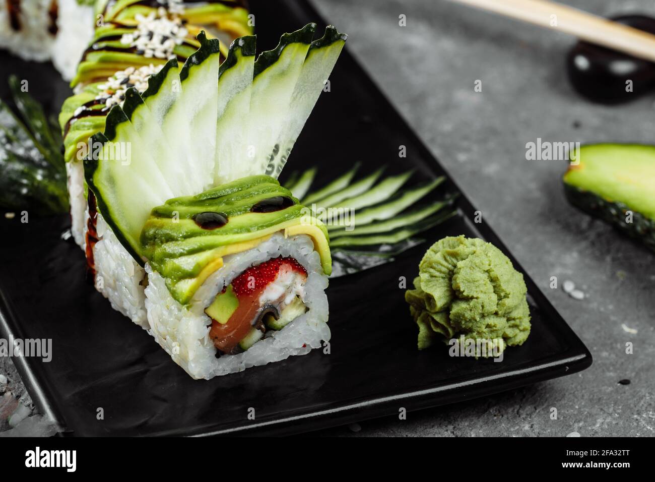 Green dragon sushi roll with eel, avocado, cucumber and ginger