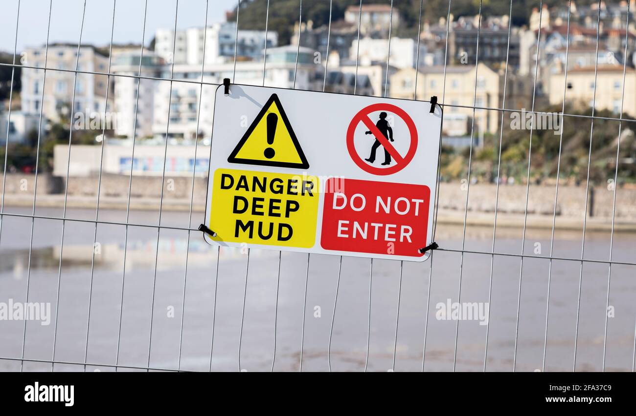 A sign warning of dangerous mud in the Marine Lake in Weston-super-Mare, UK. The lake is currently closed while work to remove excess mud takes place. Stock Photo