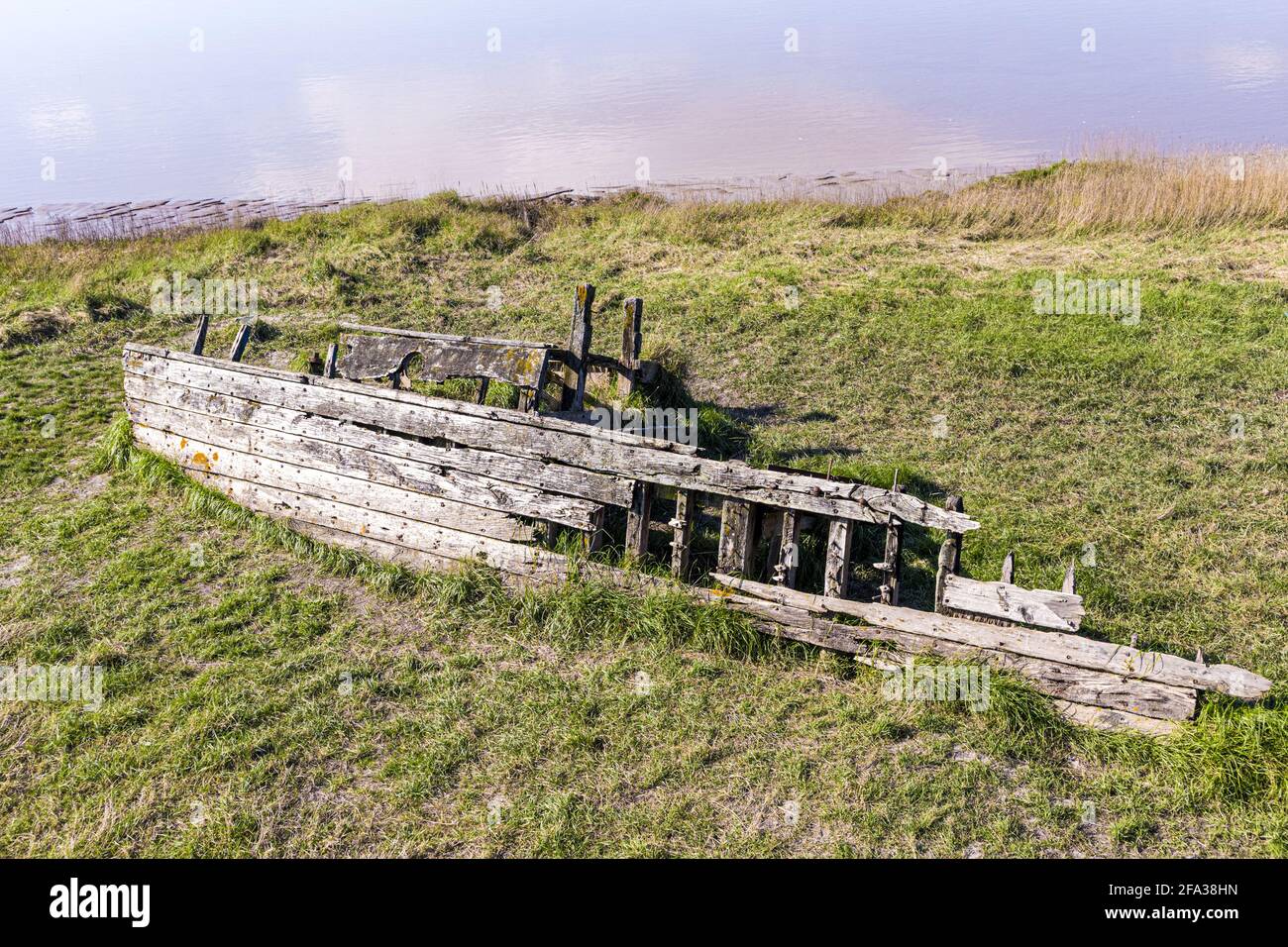 Remains of The Severn Collier, one of many such vessels deliberately beached on the banks of the River Severn to prevent erosion at The Purton Hulks. Stock Photo