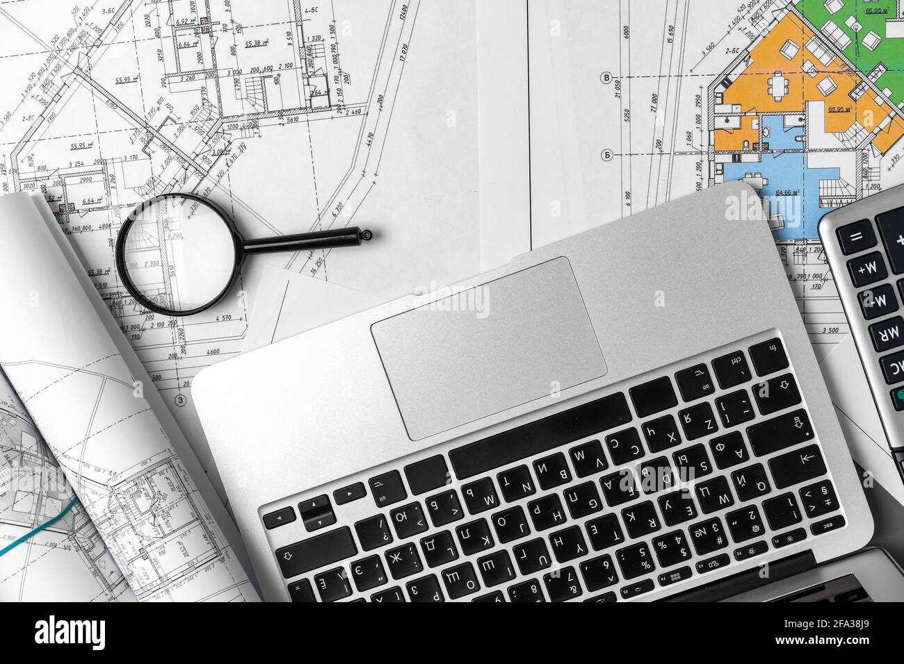 Working table of interior designer with blueprint and laptop Stock ...