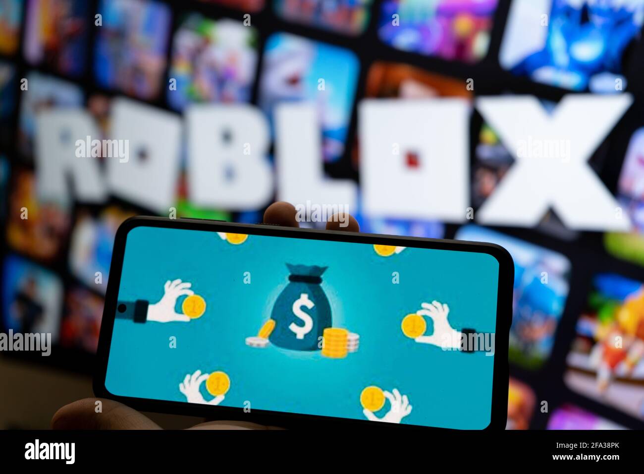 Roblox game app on the smartphone screen on blue background. Top view. Rio  de Janeiro, RJ, Brazil. June 2021. Stock Photo