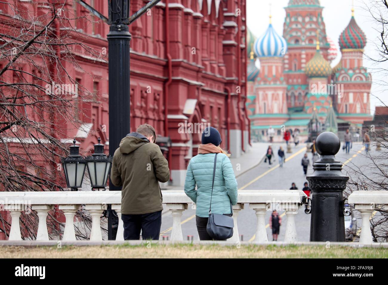 View to the Red square, State historical museum and St. Basil's Cathedral in Moscow. Tourists admire the sights of Russia in the spring Stock Photo