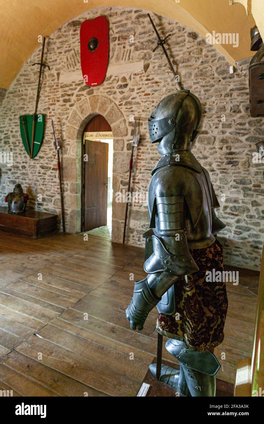 One of the rooms of the Château de Chouvigny decorated with arms, shields, banners and armor. Chouvigny, Sioule valley, Allier département, France. Stock Photo