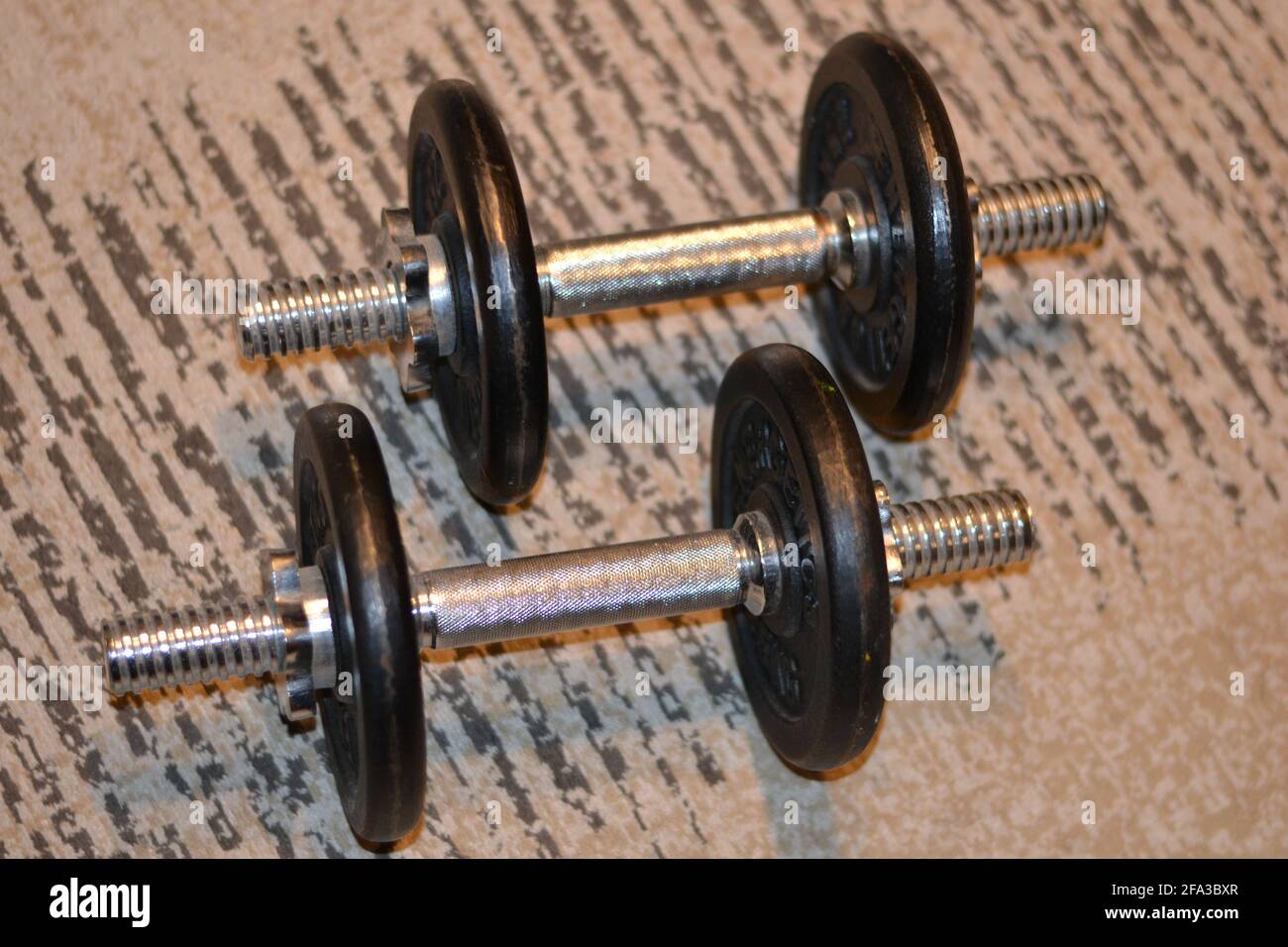 Weights on carpet Stock Photo