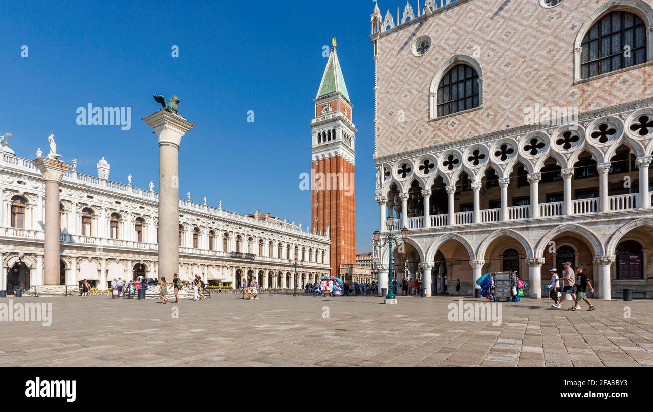 Venice, Veneto Region, Italy. The Campanile, or bell tower, left, and the Palazzo Ducale, or Ducal palace, right, seen from the Piazzetta, off St Mark Stock Photo