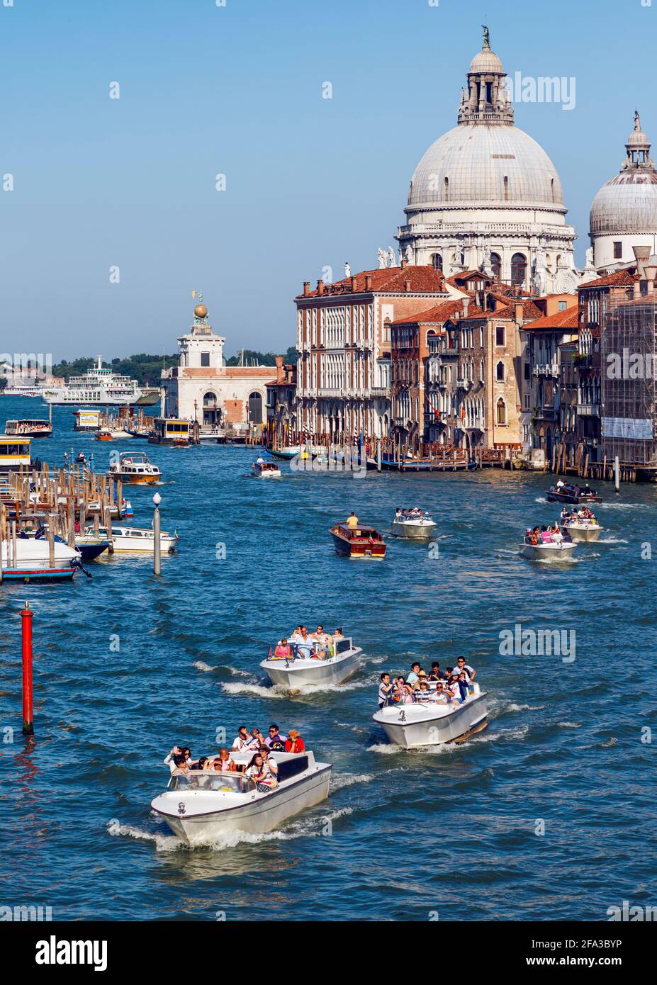 Venice, Venice Province, Veneto Region, Italy. View down Grand Canal to Santa Maria della Salute.  Venice and its lagoon are a UNESCO World Heritage S Stock Photo