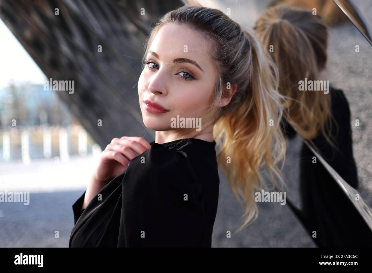 Blonde woman wearing top hi-res stock photography and images