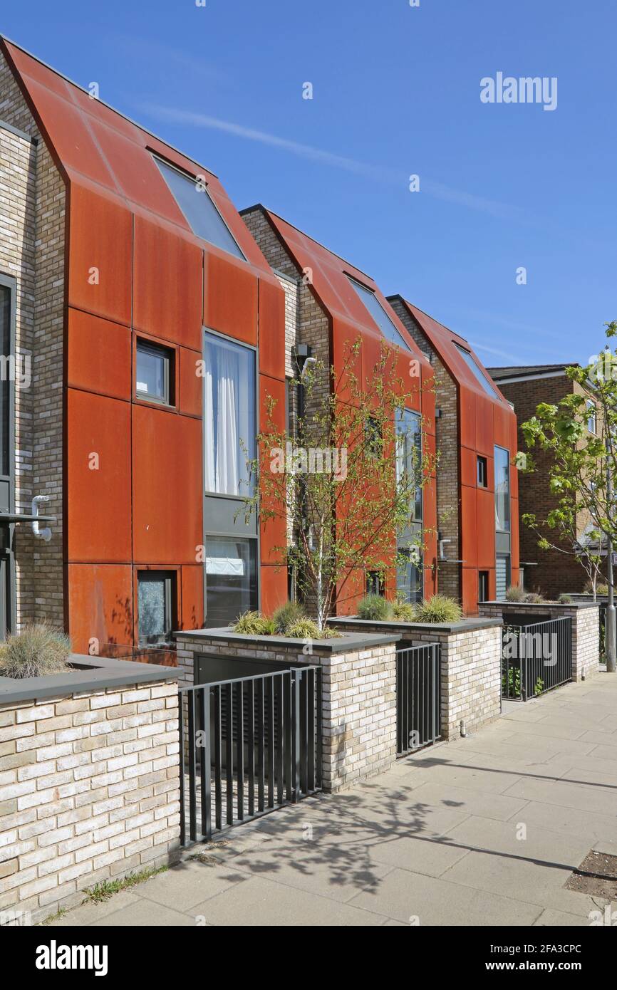 Modern houses clad in rusty 'cor-ten' weathering steel panels. Revelstoke Road, Earlsfield, southwest London, UK Stock Photo