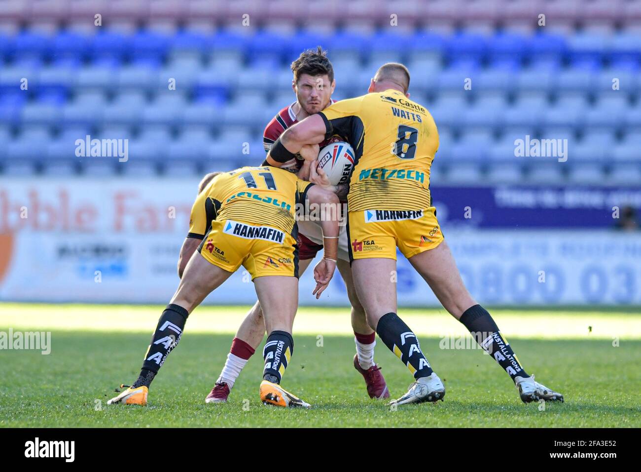 Wigan, UK. 22nd Apr, 2021. John Bateman (13) of Wigan Warriors is tackled by Liam Watts (8) of Castleford Tigers and Oliver Holmes (11) of Castleford Tigers in Wigan, United Kingdom on 4/22/2021. (Photo by Simon Whitehead/News Images/Sipa USA) Credit: Sipa USA/Alamy Live News Stock Photo