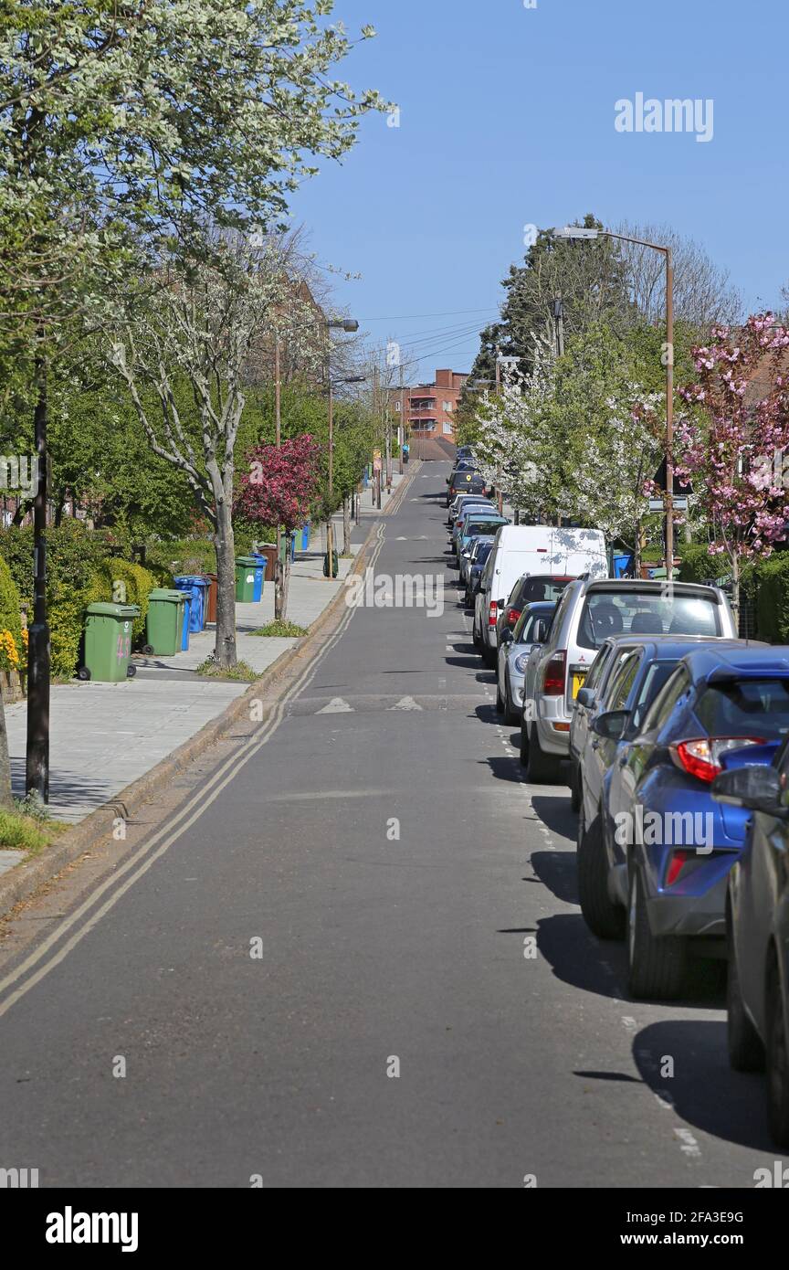 Traffic-calming speed humps on a residential street in south London, UK. Used to enforce the widespread 20mph speed limit. Stock Photo