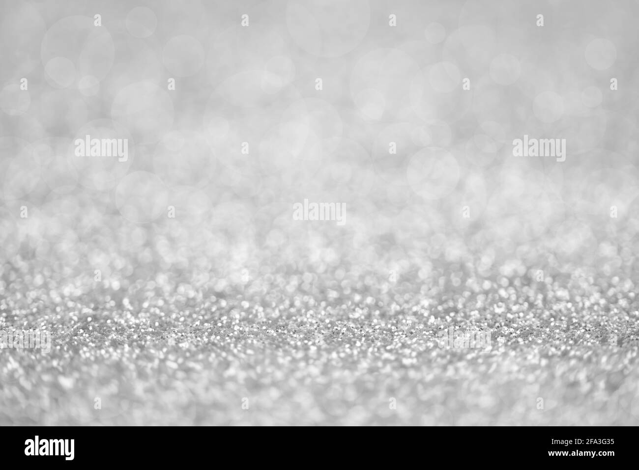 Texture of silver glitter dust surface, luxury background with bokeh