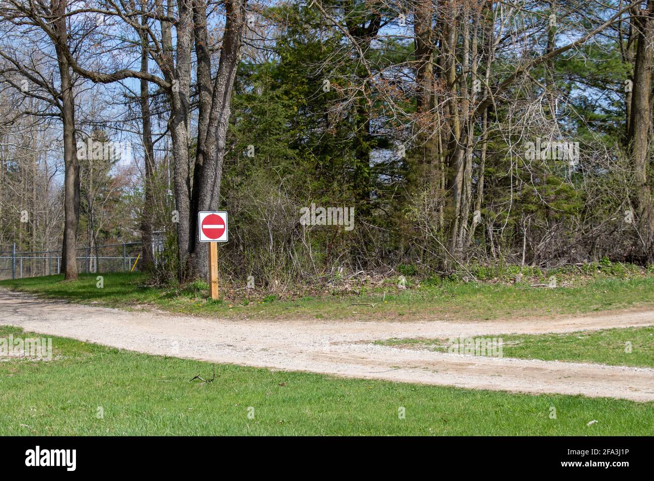 Do not enter sign at the end of a fork in the road Stock Photo