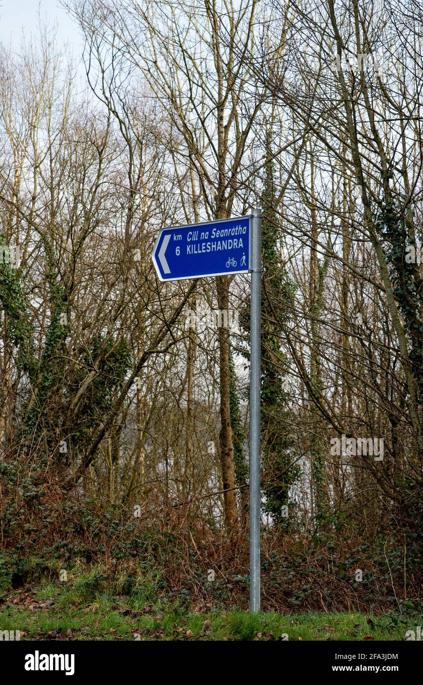 Killykeen park, Cavan, Ireland - 28 February, 2021.Sign post on two languages Irish and English in Killykeen Forest Park, Co. Cavan,  Ireland Stock Photo