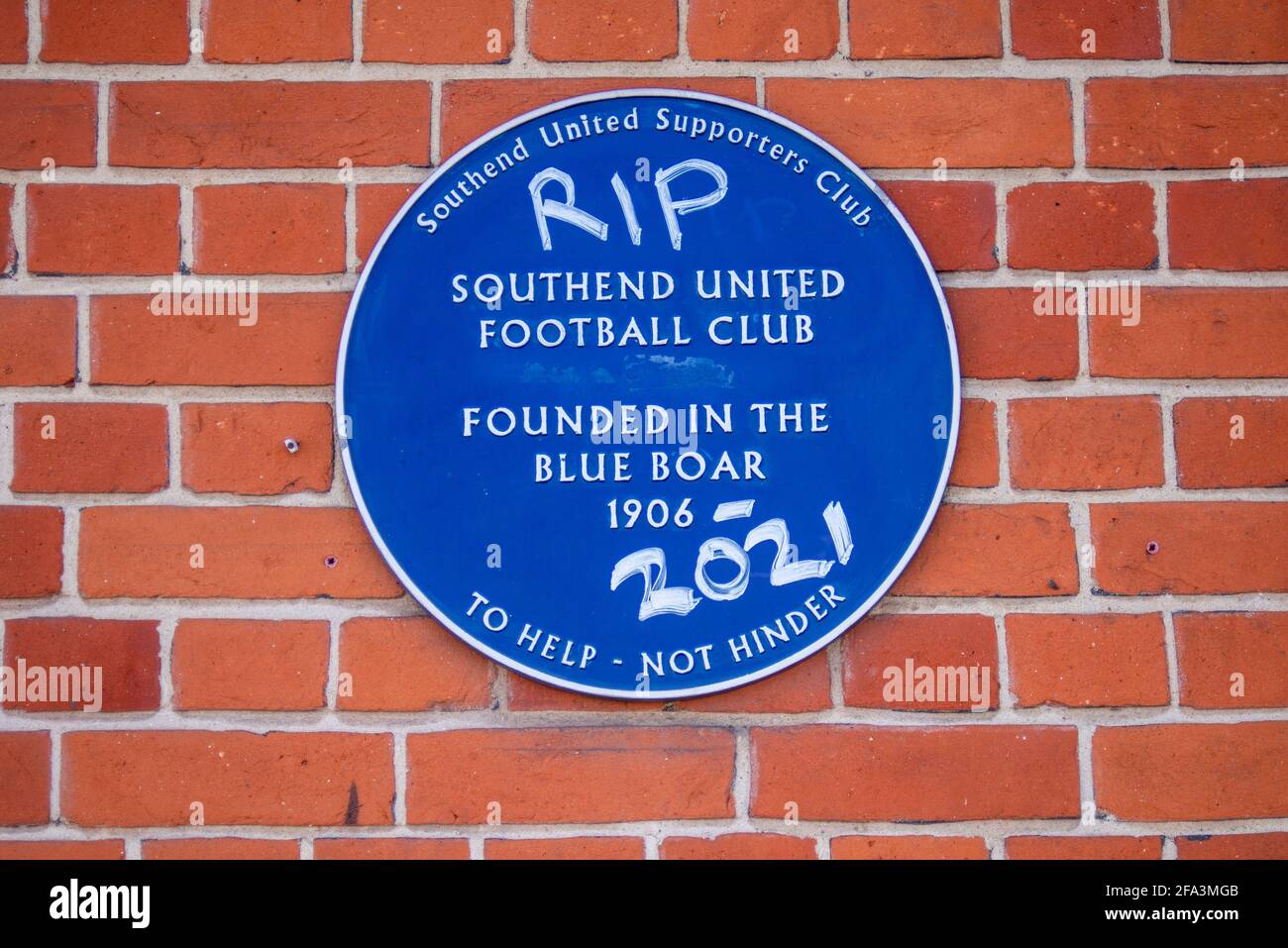 Protest graffiti outside the Blue Boar pub against Ron Martin chairman of Southend Utd football who are facing relegation. Vandalised blue plaque Stock Photo