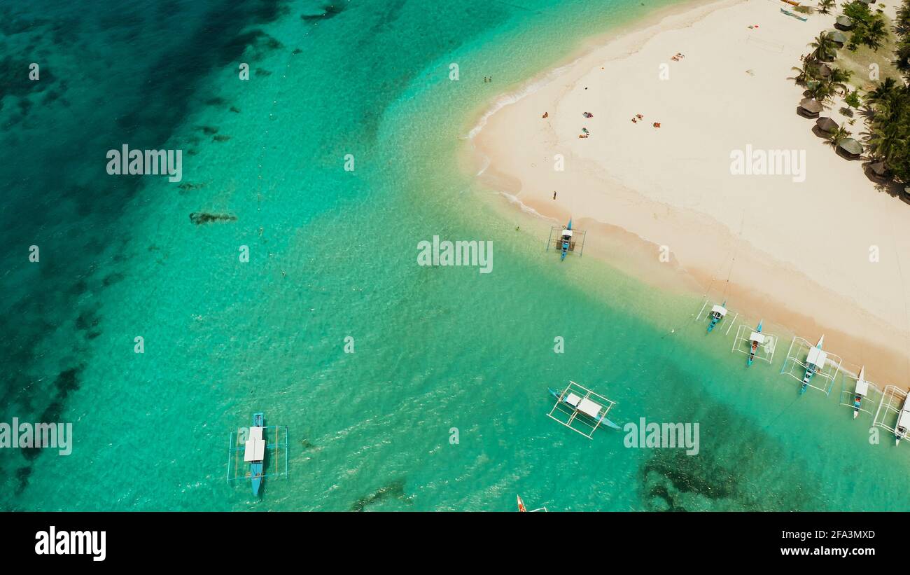 Travel concept: sandy beach on a tropical island by coral reef atoll from above. Daco island, Philippines. Summer and travel vacation concept Stock Photo