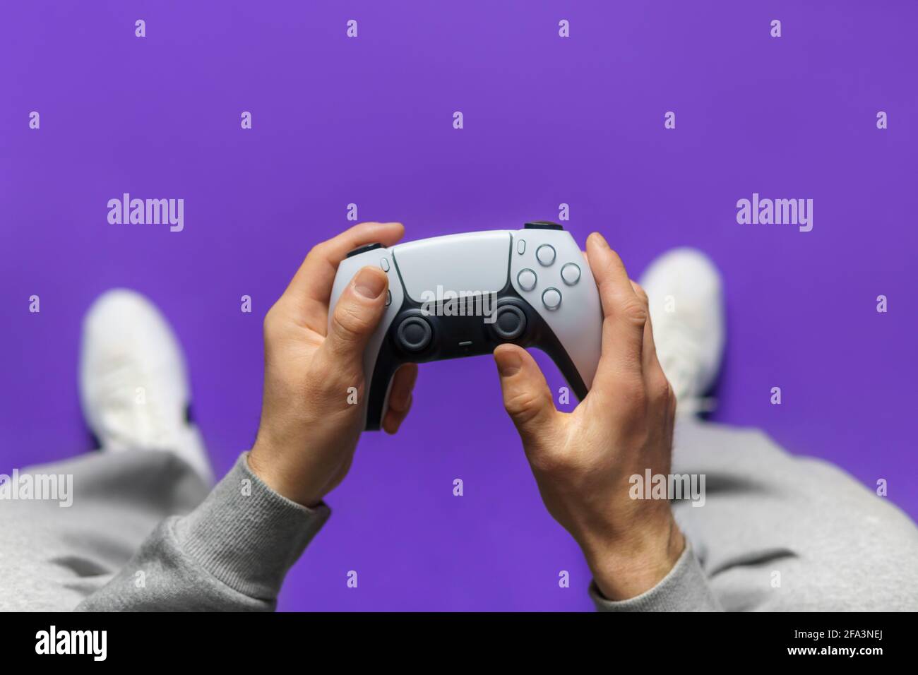 Hand hold new joystick. Gamer play game with gamepad controller. Gaming man  holding simulator joypad. Person with keypad joystic in arms. happy to win  Stock Photo - Alamy