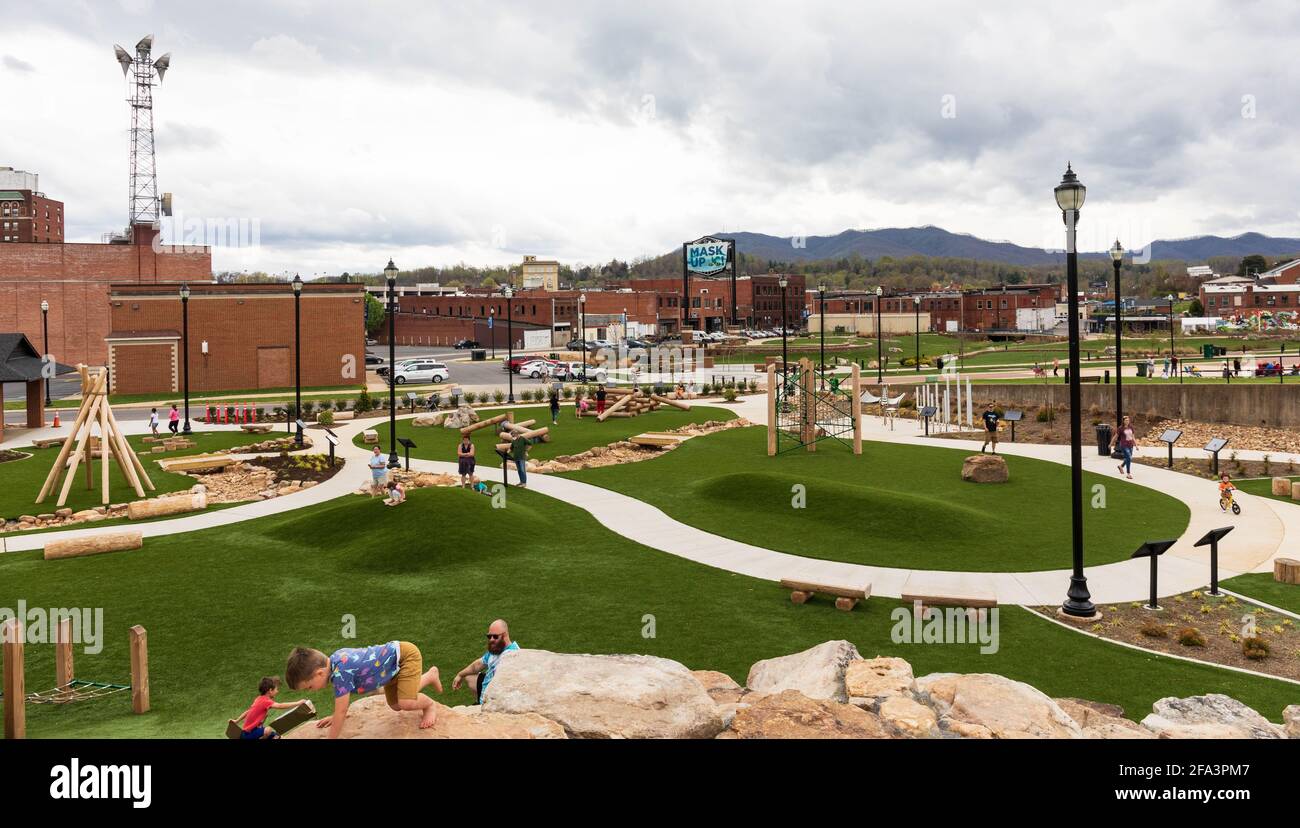 JOHNSON CITY, TN, USA-10 APRIL 2021: A view from above King Commons park, in downtown, with children and parents.  Good separation between people. Stock Photo