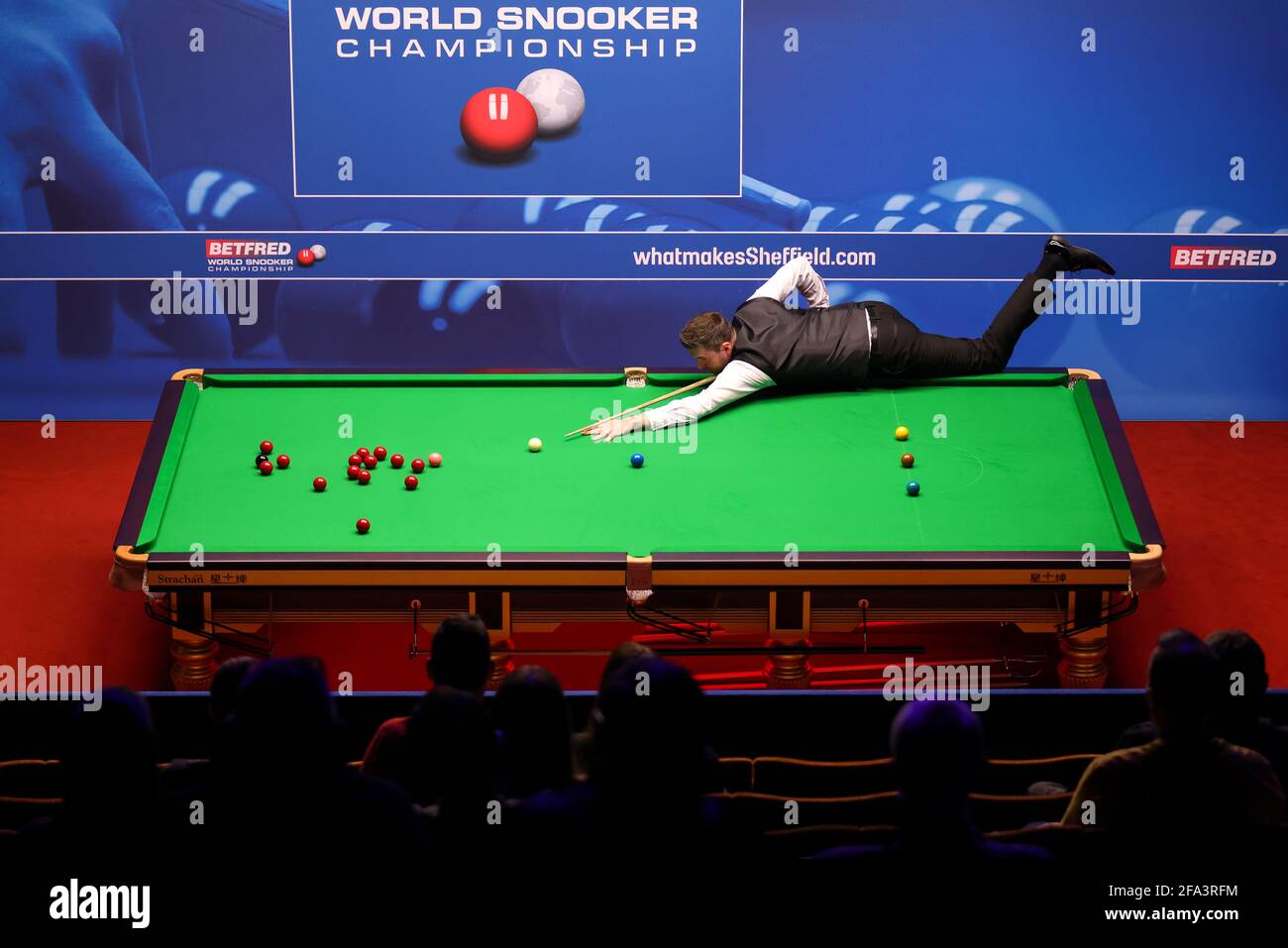 Mark Selby of England plays a shot during the Betfred World Snooker Championship Round One match between Kurt Mafin of Norway and Mark Selby of England during day six of the Betfred