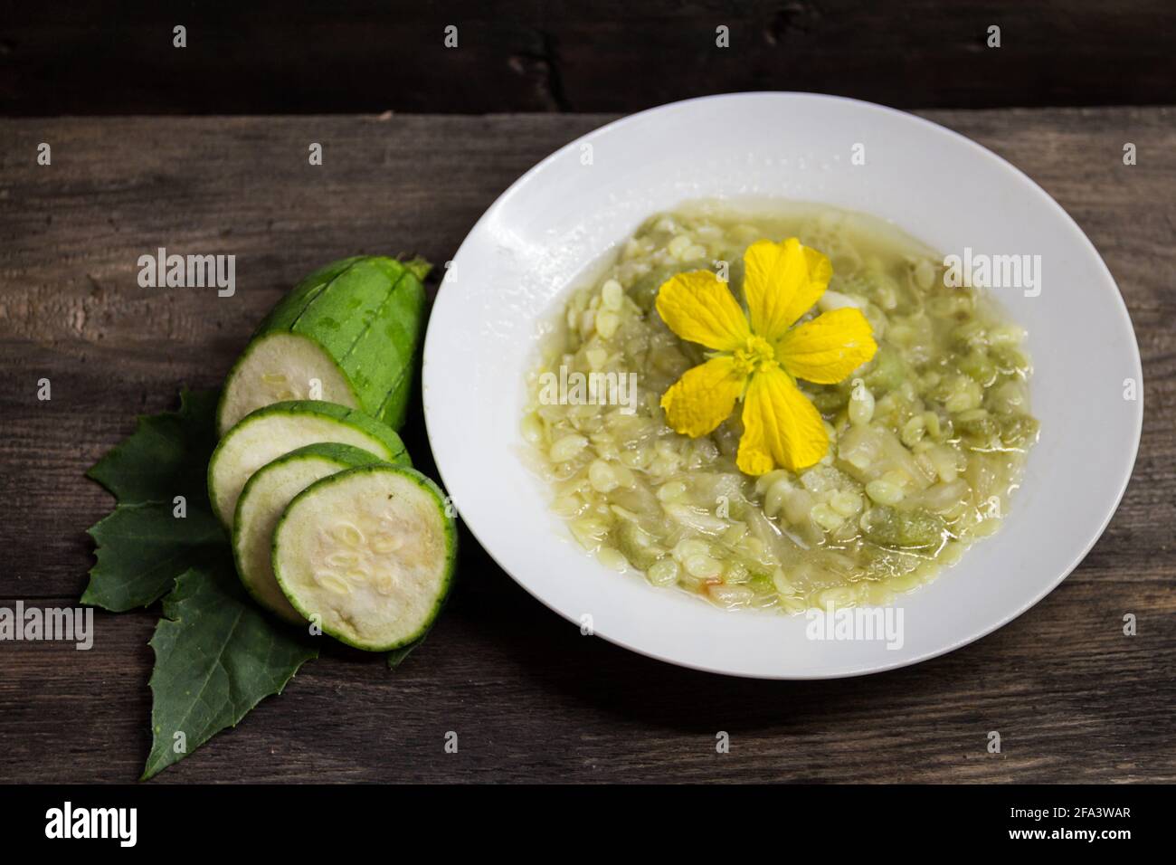 Plate of fried luffa with onion and garlic. Asian kitchen Stock Photo ...
