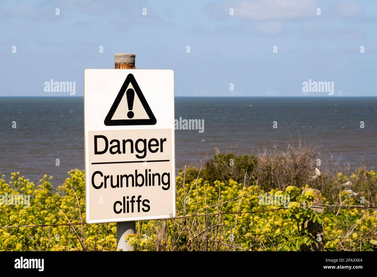 Danger Crumbling Cliffs warning sign at Old Hunstanton in Norfolk. Stock Photo