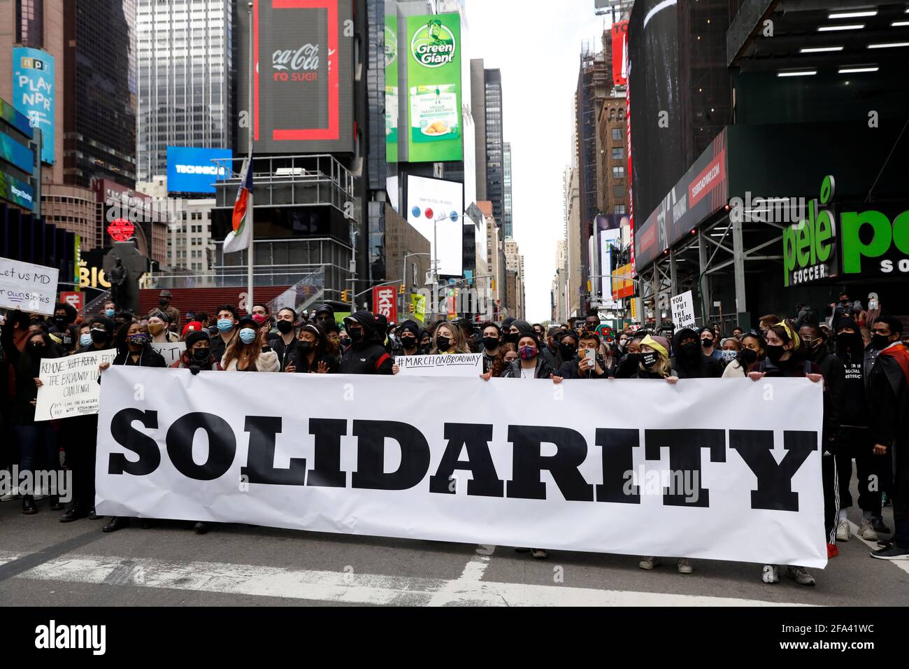 People gather during the 'March on Broadway' protest to demand proper accountability and safe work environments in the theater industry and held after abuse allegations against producer Scott Rudin, in Times Square, Manhattan, New York City, New York, U.S., April 22, 2021. REUTERS/Andrew Kelly Stock Photo