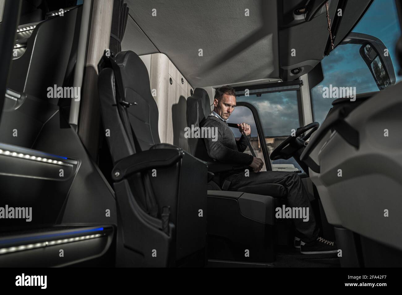 Public Transport Bus Driver Fastening Seat Belt. Caucasian Coach Bus