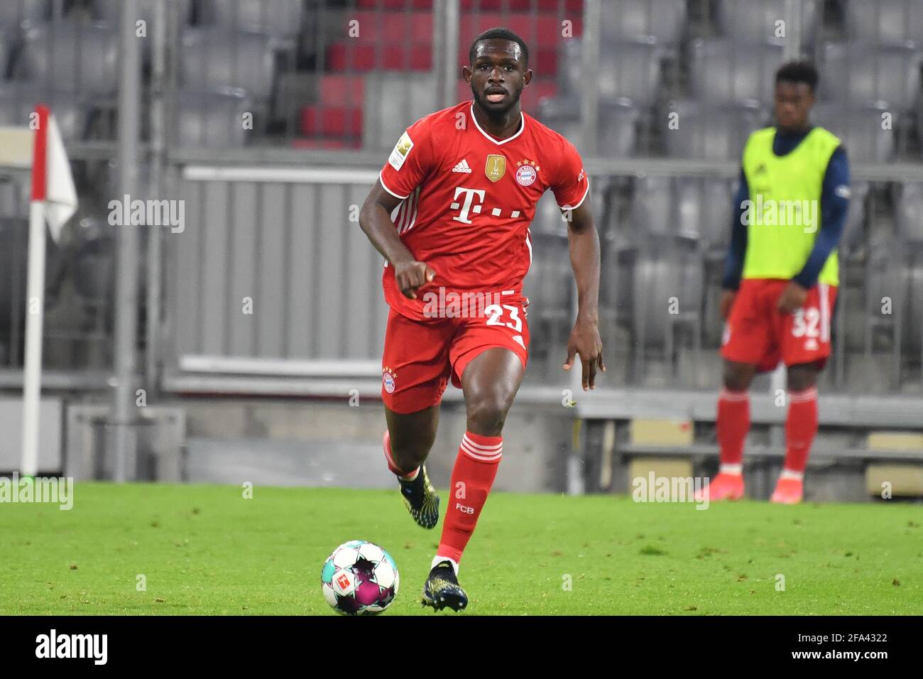 Munich, Deutschland. 20th Apr, 2021. Tanguy Nianzou Kouassi (FC Bayern  Munich). Action, single action, single image, cut out, whole body shot,  whole figure football 1st Bundesliga season 2020/2021, 30.matchday,  matchday30, FC Bayern