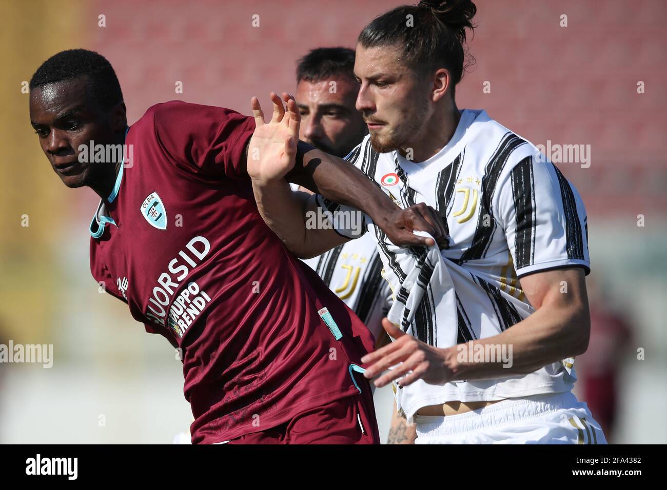 Alessandria, Italy. 22nd Apr, 2021. Radu Dragusin of Juventus tussles with  King Udoh of Olbia Calcio during the Serie C match at Stadio Giuseppe  Moccagatta - Alessandria. Picture credit should read: Jonathan