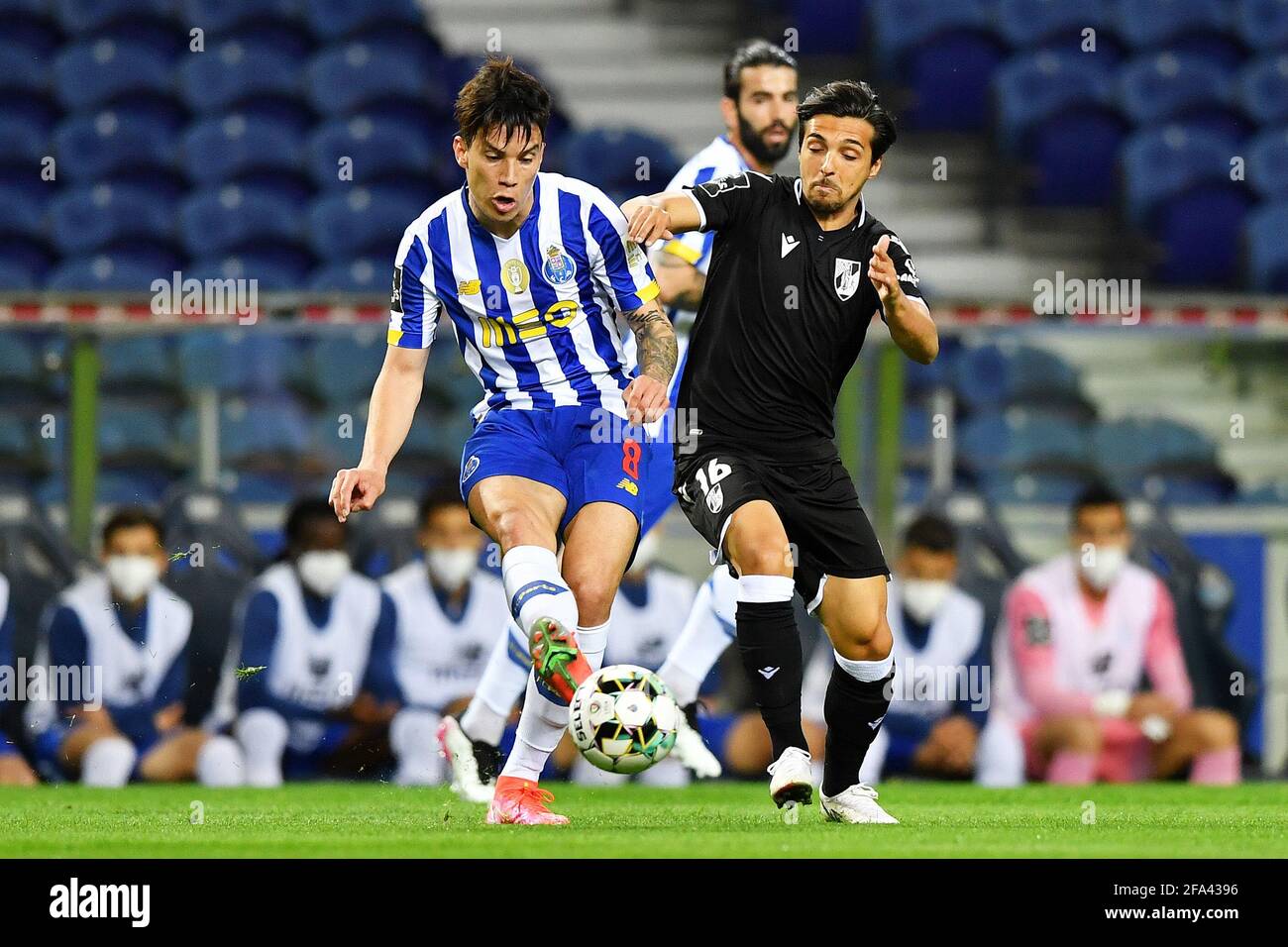 22nd April 2021; Dragao Stadium, Porto, Portugal; Portuguese Championship  2020/2021, FC Porto versus Vitoria de Guimaraes; Mateus Uribe of FC Porto  passes ahead of the challenge from Rochinha of Vitoria de Guimaraes