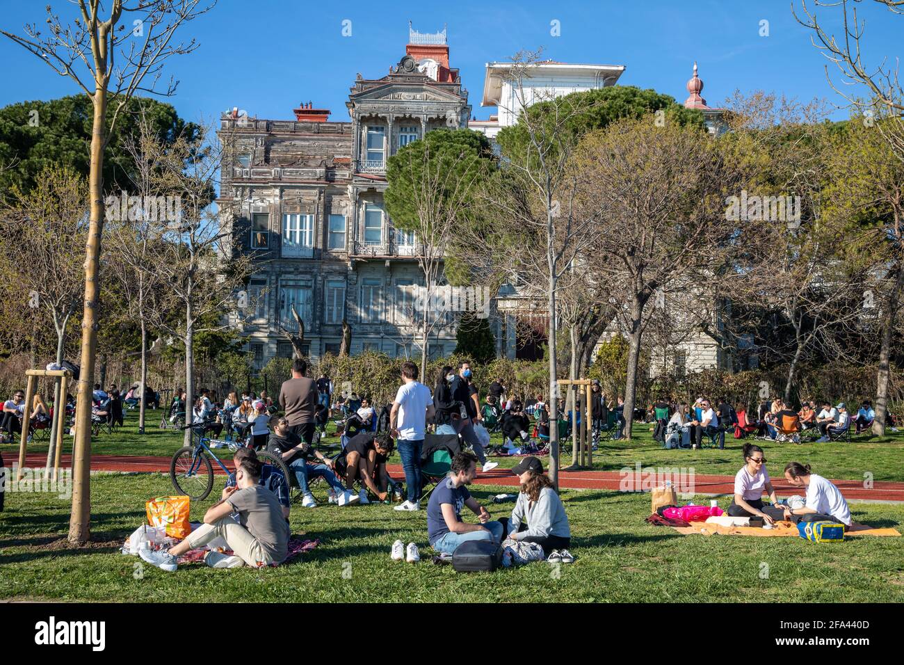 People enjoying beautiful day and sun on Bostanci coasts during pandemic outbreak days before curfew in Kadikoy, Istanbul, Turkey on April 22, 2021. Stock Photo