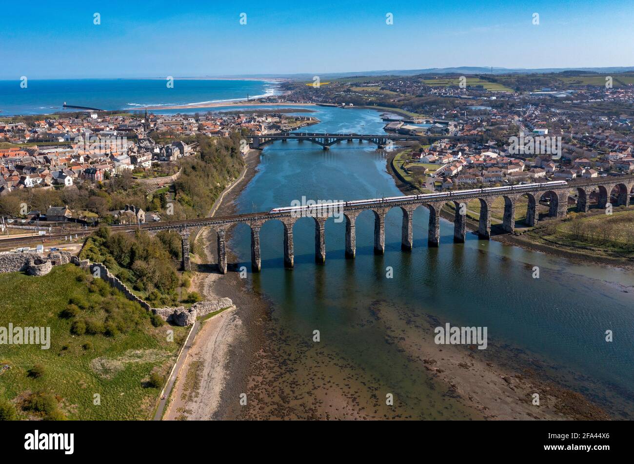 Aerial view showing a train crossing the Border Rail Bridge at Berwick Upon Tweed, Northumberland, England. Stock Photo