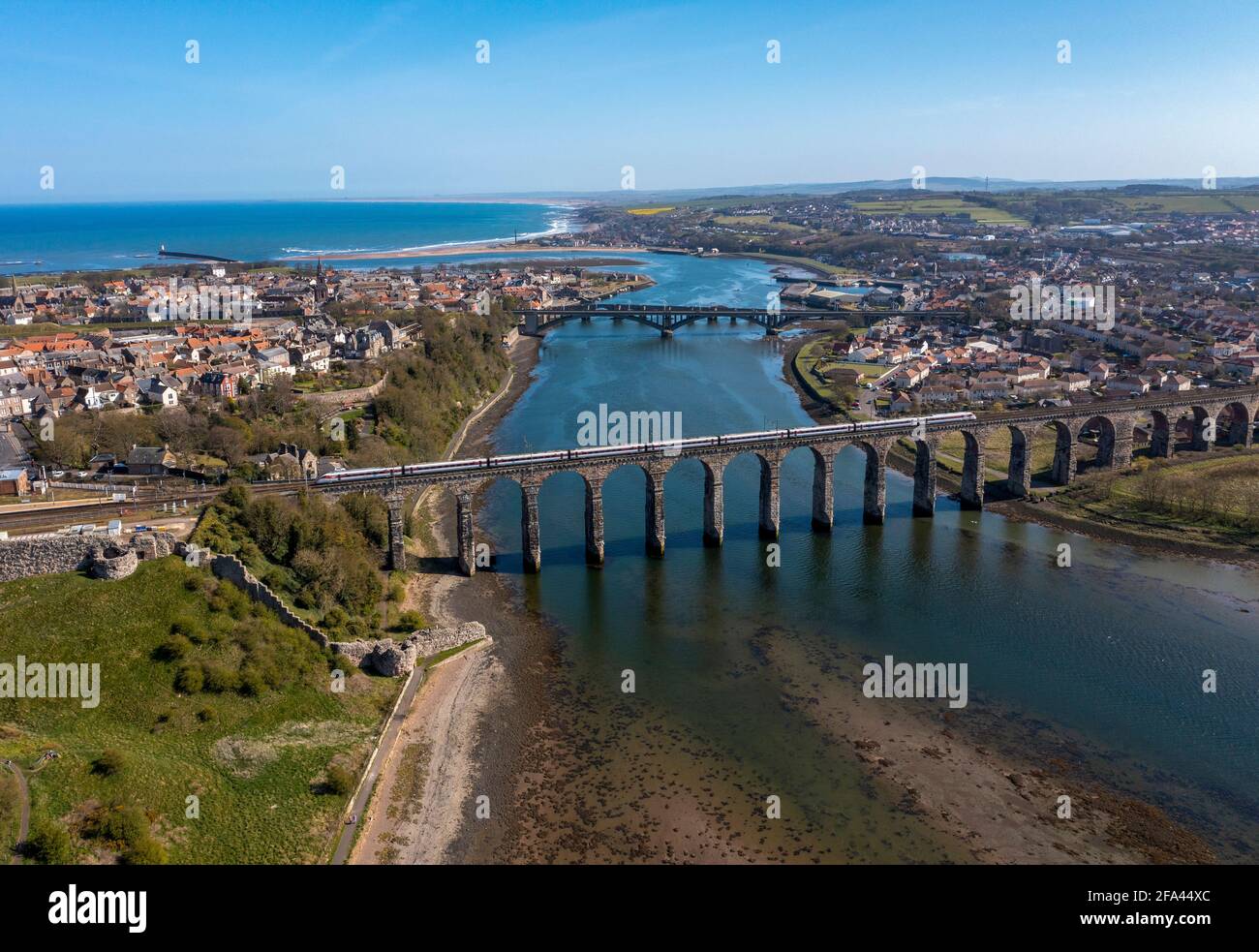 Aerial view showing a train crossing the Border Rail Bridge at Berwick Upon Tweed, Northumberland, England. Stock Photo