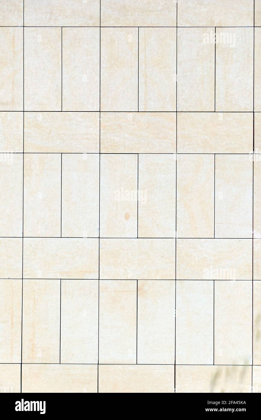 Surface in white and beige tones composed of pieces placed vertically and horizontally as a mosaic that delimit horizontal and vertical lines. Vertica Stock Photo