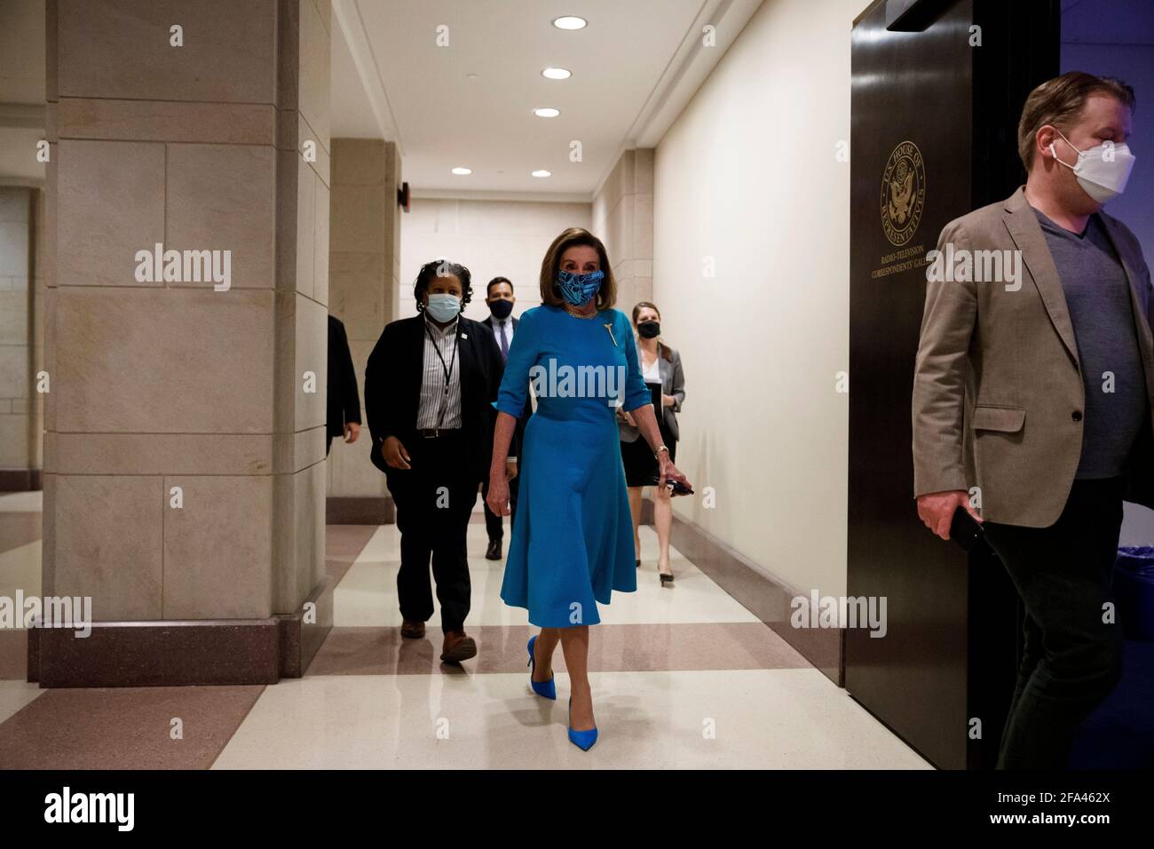 Washington, USA. 22nd Apr, 2021. U.S. House Speaker Nancy Pelosi (C) arrives for a press conference on Capitol Hill in Washington, DC, the United States, April 22, 2021. The U.S. House on Thursday voted to pass a bill that would make Washington, DC the nation's 51st state, a Democratic priority that will face an uphill battle in the Senate for final passage even as the party controls both chambers of Congress. Credit: Ting Shen/Xinhua/Alamy Live News Stock Photo