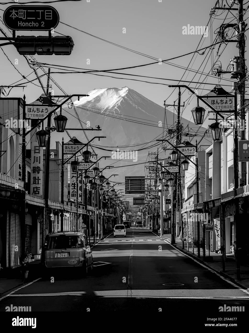 Yamanashi, Japan - November 17 2020: Monochrome image of Mount Fuji from a street in the city of Fujiyoshida on a clear morning Stock Photo