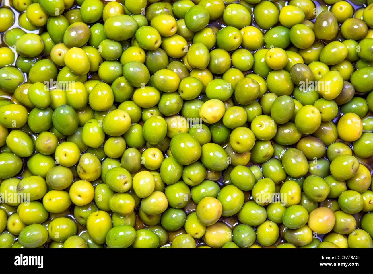 Awesome green olives in water Stock Photo Alamy