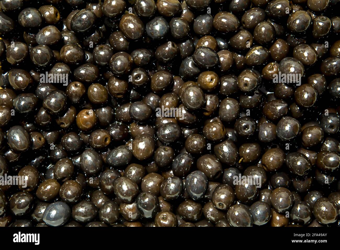 Awesome black olives in water Stock Photo