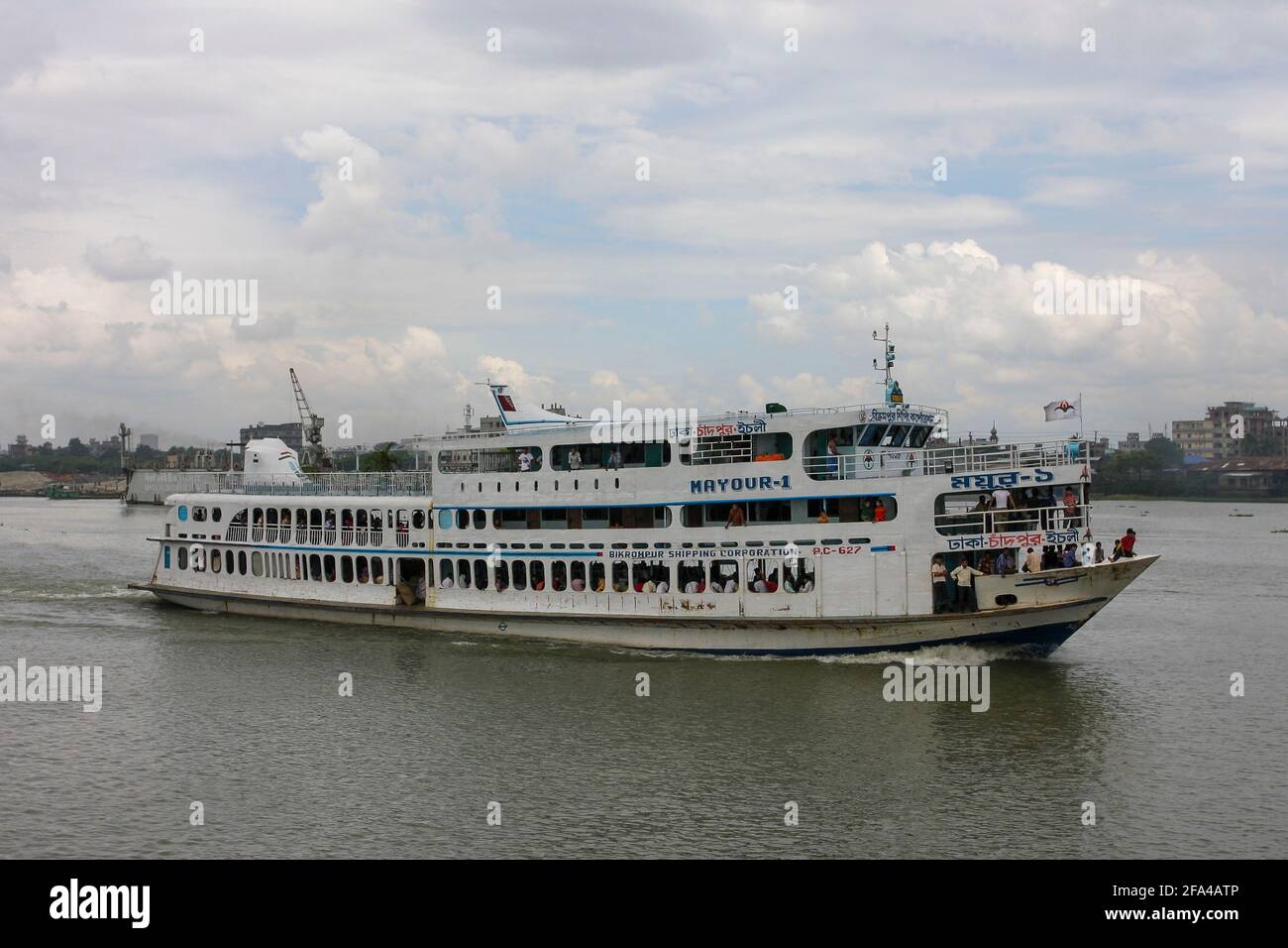 A passenger vessel moves on the Buriganga River, Dhaka, Bangladesh Stock Photo