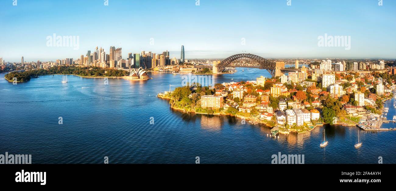 Major city landmarks of Sydney on Harbour waterfront around the Bridge - aerial panorama. Stock Photo